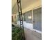 Covered front porch showcasing gray textured walls and the front door to the home at 467 34Th N Ave, St Petersburg, FL 33704