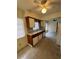 Cozy kitchen featuring white appliances, a ceiling fan, and warm wood cabinetry at 467 34Th N Ave, St Petersburg, FL 33704