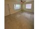 Open living room with terrazzo floors, ceiling fan, and lots of natural light at 467 34Th N Ave, St Petersburg, FL 33704