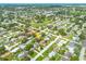 Neighborhood aerial view of the property, showcasing its placement in a tree-lined residential area at 5262 25Th N Ave, St Petersburg, FL 33710