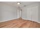 Bedroom with hardwood floors, neutral paint, and a closet for ample storage at 5262 25Th N Ave, St Petersburg, FL 33710