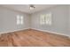 Bedroom with hardwood floors, neutral paint, ceiling fan, and windows with white shutters at 5262 25Th N Ave, St Petersburg, FL 33710