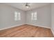 This bedroom features hardwood floors, ceiling fan, neutral paint, and windows with white shutters at 5262 25Th N Ave, St Petersburg, FL 33710
