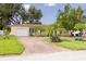 Inviting single-Gathering home with a brick driveway, attached garage, and well-maintained landscaping at 5262 25Th N Ave, St Petersburg, FL 33710