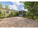 Charming home with a brick paver patio and lush landscaping, creating a serene outdoor living space at 5262 25Th N Ave, St Petersburg, FL 33710