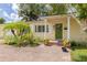 Close-up view of a charming home with a brick walkway leading to an inviting green front door at 5262 25Th N Ave, St Petersburg, FL 33710