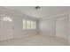 Bright and airy living room with tile flooring, neutral walls, and a doorway leading to another room at 5262 25Th N Ave, St Petersburg, FL 33710