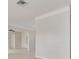 Open concept living room with tile floors, neutral paint, and arched doorway leading to dining area at 5262 25Th N Ave, St Petersburg, FL 33710