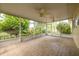 Large screened porch with wood-look tile flooring and two ceiling fans provides generous space at 5262 25Th N Ave, St Petersburg, FL 33710
