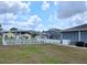 Backyard with shuffle board and screened in pool at 5755 Yorkshire Dr, Zephyrhills, FL 33542