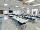 Large event room with ample seating, perfect for community gatherings and activities at 5755 Yorkshire Dr, Zephyrhills, FL 33542