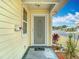 Inviting front porch featuring a decorative screen door and a well-manicured garden at 5755 Yorkshire Dr, Zephyrhills, FL 33542