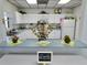 Functioning kitchen with white cabinets at 5755 Yorkshire Dr, Zephyrhills, FL 33542