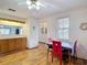 Kitchen with hardwood floors, breakfast table, and wooden cabinets at 5755 Yorkshire Dr, Zephyrhills, FL 33542