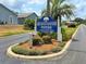 Community sign for Wedgewood Manor, a 55 and over retirement community with lush landscaping at 5755 Yorkshire Dr, Zephyrhills, FL 33542