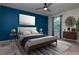 Beautifully decorated bedroom with a large bed, stylish decor, and a ceiling fan for added comfort at 5916 Tulip Flower Dr, Riverview, FL 33578