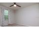 Bedroom with carpeted floors, neutral walls and curtains with colored polka dots at 5916 Tulip Flower Dr, Riverview, FL 33578