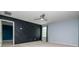 Bedroom featuring an accent wall and ample closet space at 5916 Tulip Flower Dr, Riverview, FL 33578