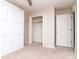 This bedroom has built in shelves and cabinets and neutral carpet at 5916 Tulip Flower Dr, Riverview, FL 33578