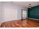 Dining room showcasing hardwood floors and a decorative light fixture at 5916 Tulip Flower Dr, Riverview, FL 33578