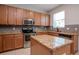Spacious kitchen with stainless steel appliances and granite countertops at 5916 Tulip Flower Dr, Riverview, FL 33578
