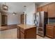 Modern kitchen with stainless steel refrigerator and center island at 5916 Tulip Flower Dr, Riverview, FL 33578