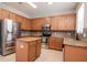 Bright kitchen features stainless steel appliances and a center island at 5916 Tulip Flower Dr, Riverview, FL 33578