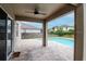 Covered patio overlooks a private pool and fenced backyard at 5916 Tulip Flower Dr, Riverview, FL 33578