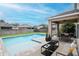 Backyard swimming pool with patio seating and privacy fence, perfect for outdoor relaxation at 5916 Tulip Flower Dr, Riverview, FL 33578