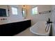 Elegant bathroom featuring a freestanding tub, stylish fixtures, and modern vanities at 608 Grove N St, St Petersburg, FL 33701