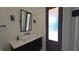 Stylish bathroom featuring a contemporary vanity with a vessel sink and modern fixtures at 608 Grove N St, St Petersburg, FL 33701