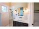 Elegant bathroom featuring a glass-enclosed shower, a vanity with modern fixtures and finishes at 608 Grove N St, St Petersburg, FL 33701
