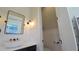 Stylish powder room with a vessel sink, black fixtures, and modern lighting sconces at 608 Grove N St, St Petersburg, FL 33701