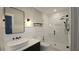 Stylish bathroom showcasing a glass-enclosed shower, vessel sink, and sleek black hardware at 608 Grove N St, St Petersburg, FL 33701