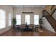 Elegant dining room featuring hardwood floors, plantation shutters, modern lighting, and direct access to stairs at 608 Grove N St, St Petersburg, FL 33701