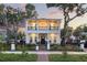 Beautiful two-story home boasts a large front porch and second story balcony with decorative iron railings at 608 Grove N St, St Petersburg, FL 33701