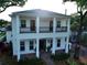 Elegant two-story home with a classic front porch and balcony at 608 Grove N St, St Petersburg, FL 33701