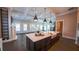 Open kitchen and living space featuring hardwood floors, stainless appliances, an island, and modern finishes at 608 Grove N St, St Petersburg, FL 33701