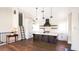 A sleek kitchen featuring an island, modern appliances, and open shelving at 608 Grove N St, St Petersburg, FL 33701