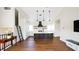 A sleek kitchen featuring an island, modern appliances, and open shelving at 608 Grove N St, St Petersburg, FL 33701