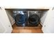 Modern laundry room with LG washer and dryer on hardwood floor at 608 Grove N St, St Petersburg, FL 33701