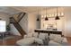 Open floor plan with kitchen island, modern cabinetry and appliances and a staircase to the second floor at 608 Grove N St, St Petersburg, FL 33701