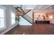 Open-concept living and kitchen area featuring hardwood floors, plantation shutters, and modern finishes at 608 Grove N St, St Petersburg, FL 33701