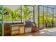 An outdoor kitchen with stainless steel appliances and brick siding provides a perfect space for entertainment at 608 Grove N St, St Petersburg, FL 33701