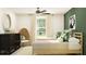Bright bedroom featuring two twin beds, stylish furniture, and an abundance of natural light at 6394 Journey Way, New Port Richey, FL 34655