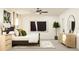 Bright bedroom with neutral colors, large bed, modern art and wood-look nightstands at 6394 Journey Way, New Port Richey, FL 34655