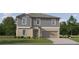 Charming two-story home featuring a neutral color palette and a well-manicured front lawn, creating a welcoming curb appeal at 6394 Journey Way, New Port Richey, FL 34655