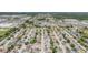 An aerial view shows a densely populated residential neighborhood near commercial areas at 6908 Mesa Verde St, Port Richey, FL 34668