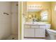 Well-maintained bathroom with tiled shower, vanity, and plenty of natural light at 6908 Mesa Verde St, Port Richey, FL 34668
