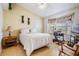 Bright bedroom with natural light, a ceiling fan, and a workstation setup by the window at 6908 Mesa Verde St, Port Richey, FL 34668